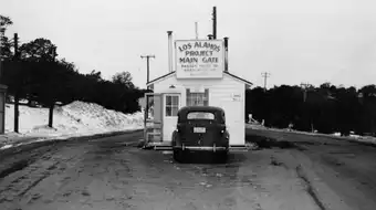 The main security gate to Project Y at Los Alamos, New Mexico, 1943. The checkpoint where the outside world ended and The Hill began.